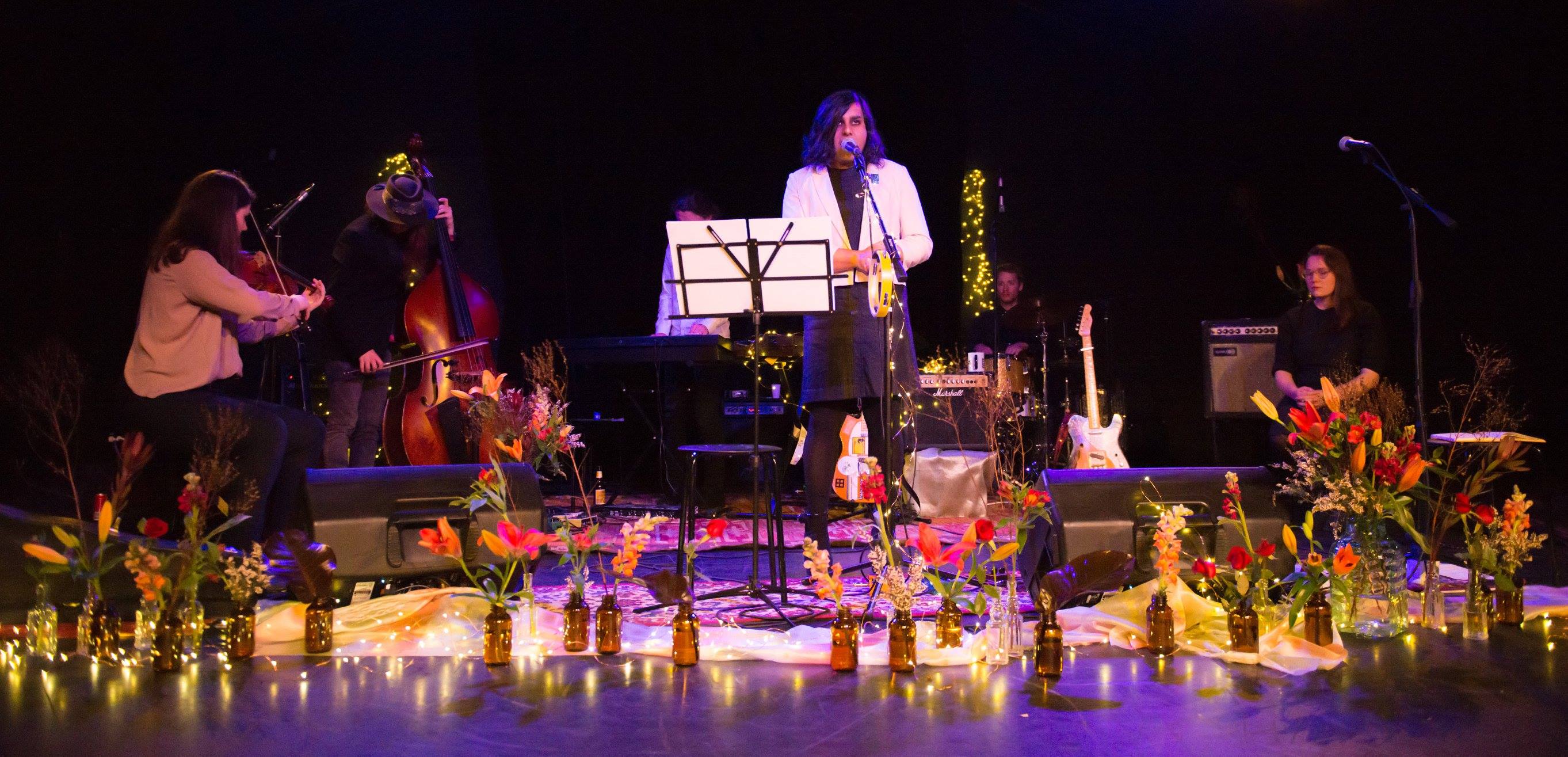  A photo of Shoeb Ahmad performing with her band. 